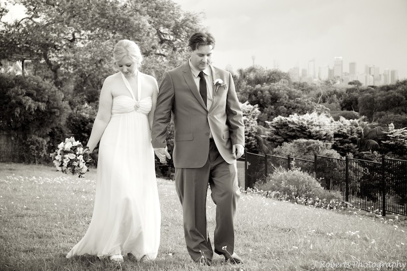Sepia bride and groom walking at sunset - wedding photography sydney